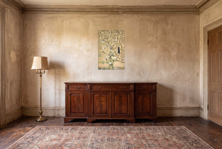 The Tree of Life full bleed print hanging unframed in a vintage style room